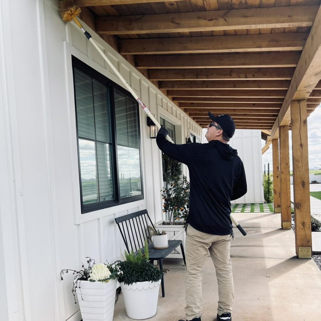 ProStrike Pest Solutions technician inspecting a residential kitchen in Queen Creek, AZ for German cockroach nesting zones and moisture-prone harborage areas